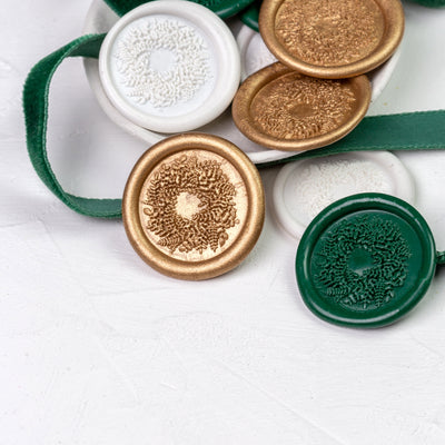 Hand-stamped Christmas wreath wax seal display in gold, green and white | Heirloom Seals
