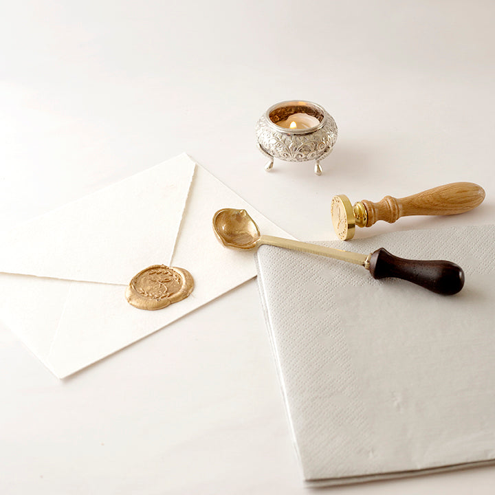 Wax Spoon And Wax Stamp Lying On Envelope With Traditional Wax Seal | How To Clean Your Wax Spoon | Heirloom Seals