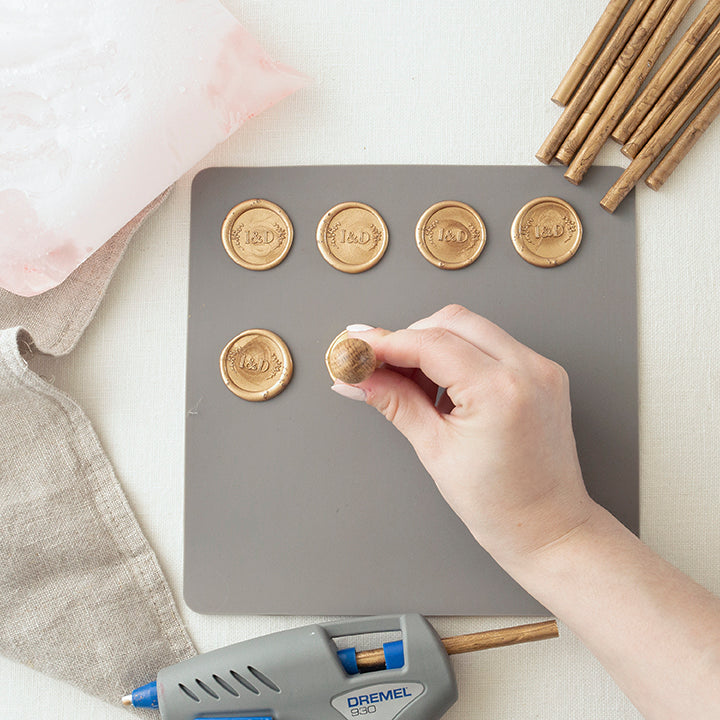 Gold Wax Seals Being Stamped onto a Silicone Mat | How to Make Wax Seals | Heirloom Seals