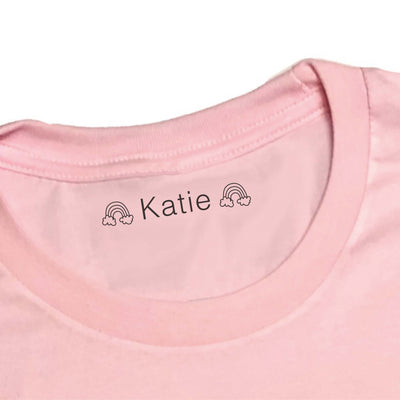 Girls name stamp with rainbows on pink top | fabric stamp