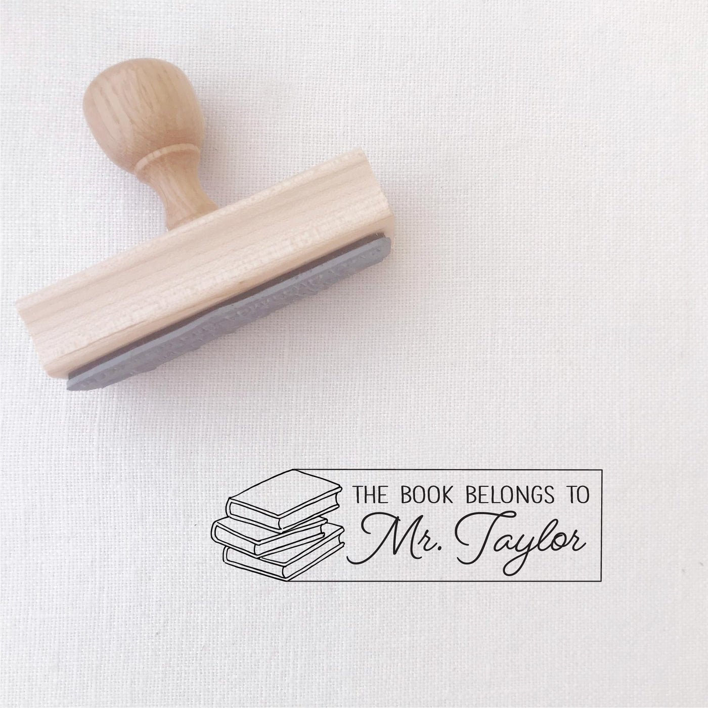 THIS BOOK BELONGS TO SCRIPT TEACHER STAMP WITH BOOK ILLUSTRATION | HEIRLOOM SEALS