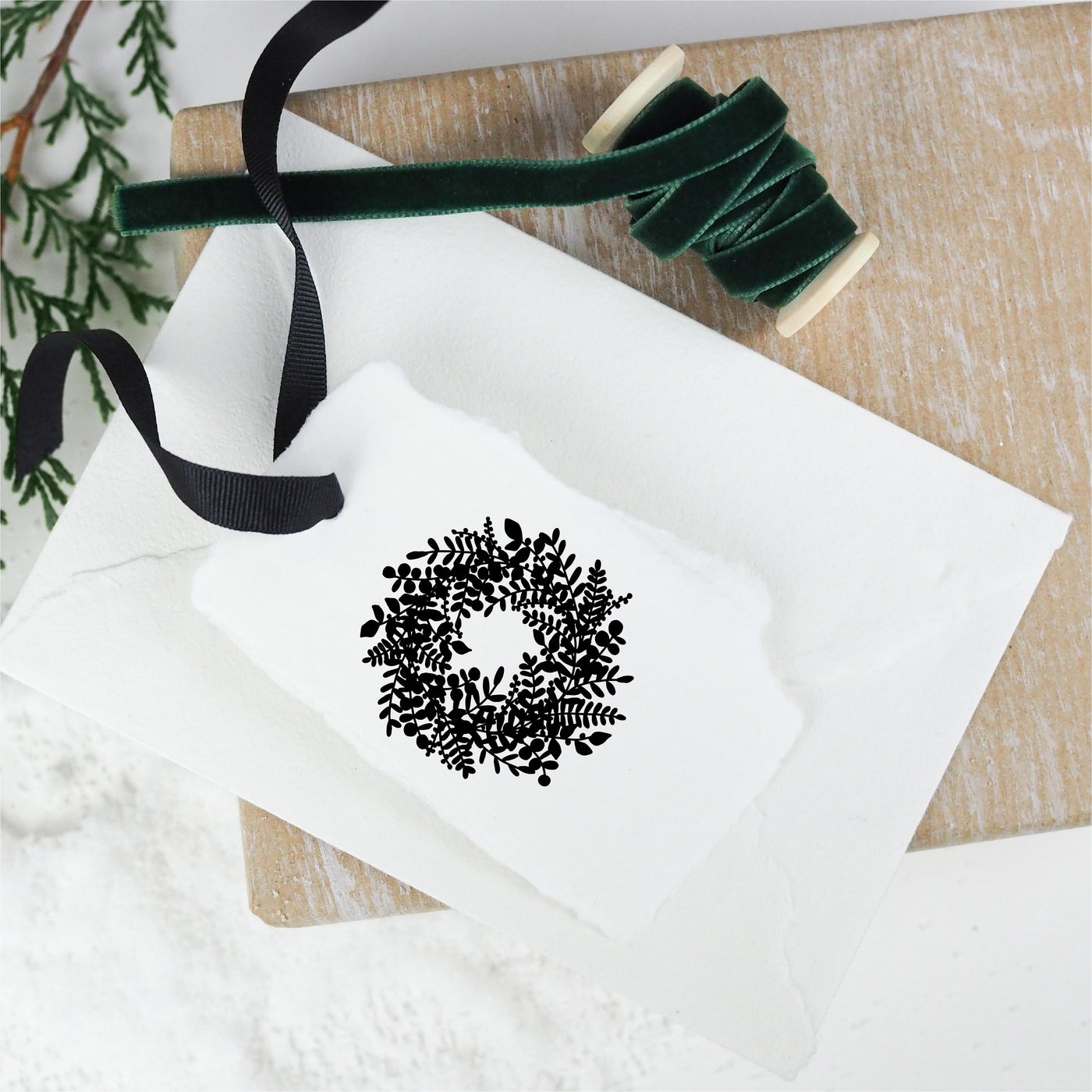 White gift tag stamped with Christmas gift and ribbon | Heirloom Seals