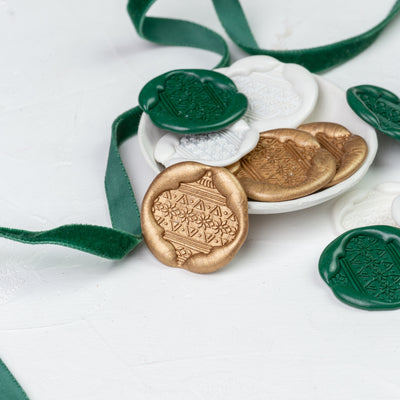 Hand-pressed green, white and gold Christmas bauble wax seal display | Heirloom Seals