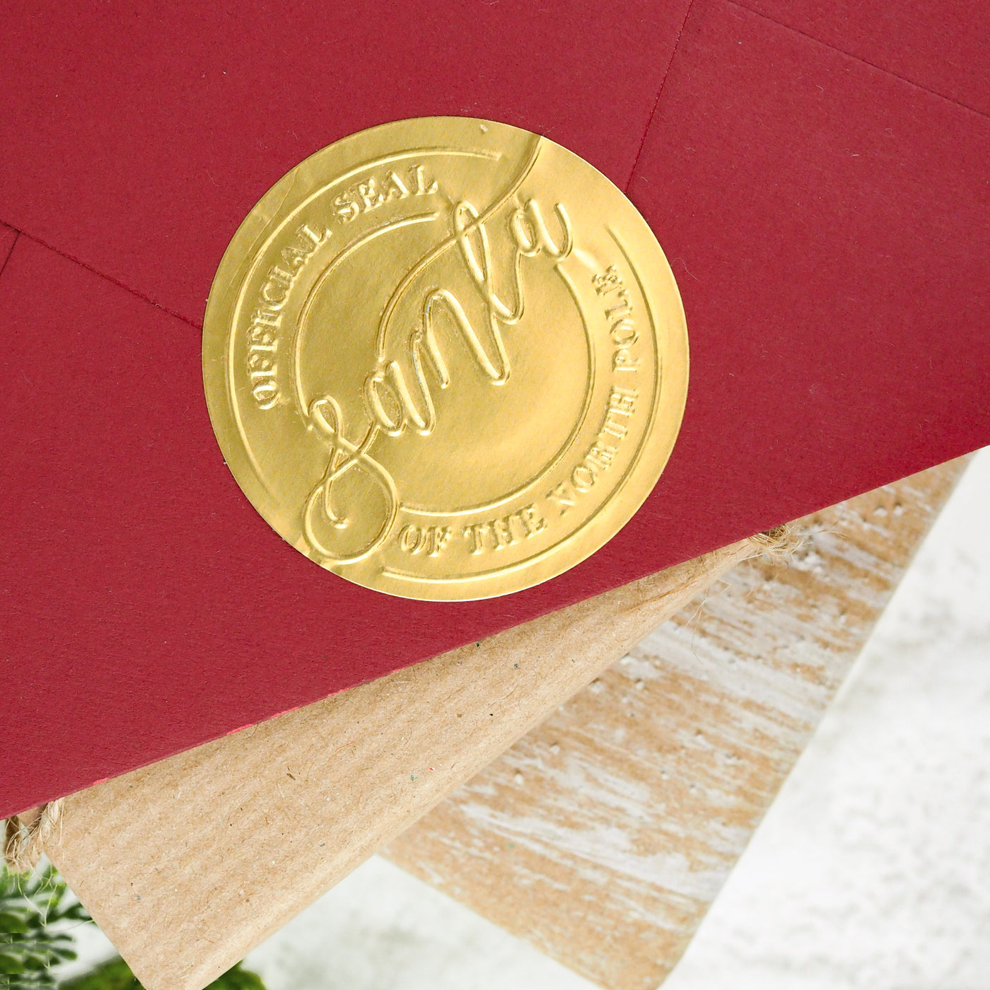 Gold Official Santa Seal Embossed Sticker on Red Envelope | Believe Christmas Collection | Heirloom Seals