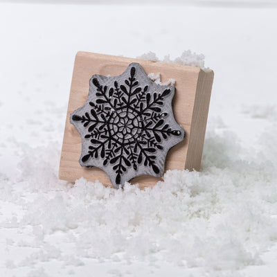 Winter snowflake wooden rubber stamp in the snow | Heirloom Seals